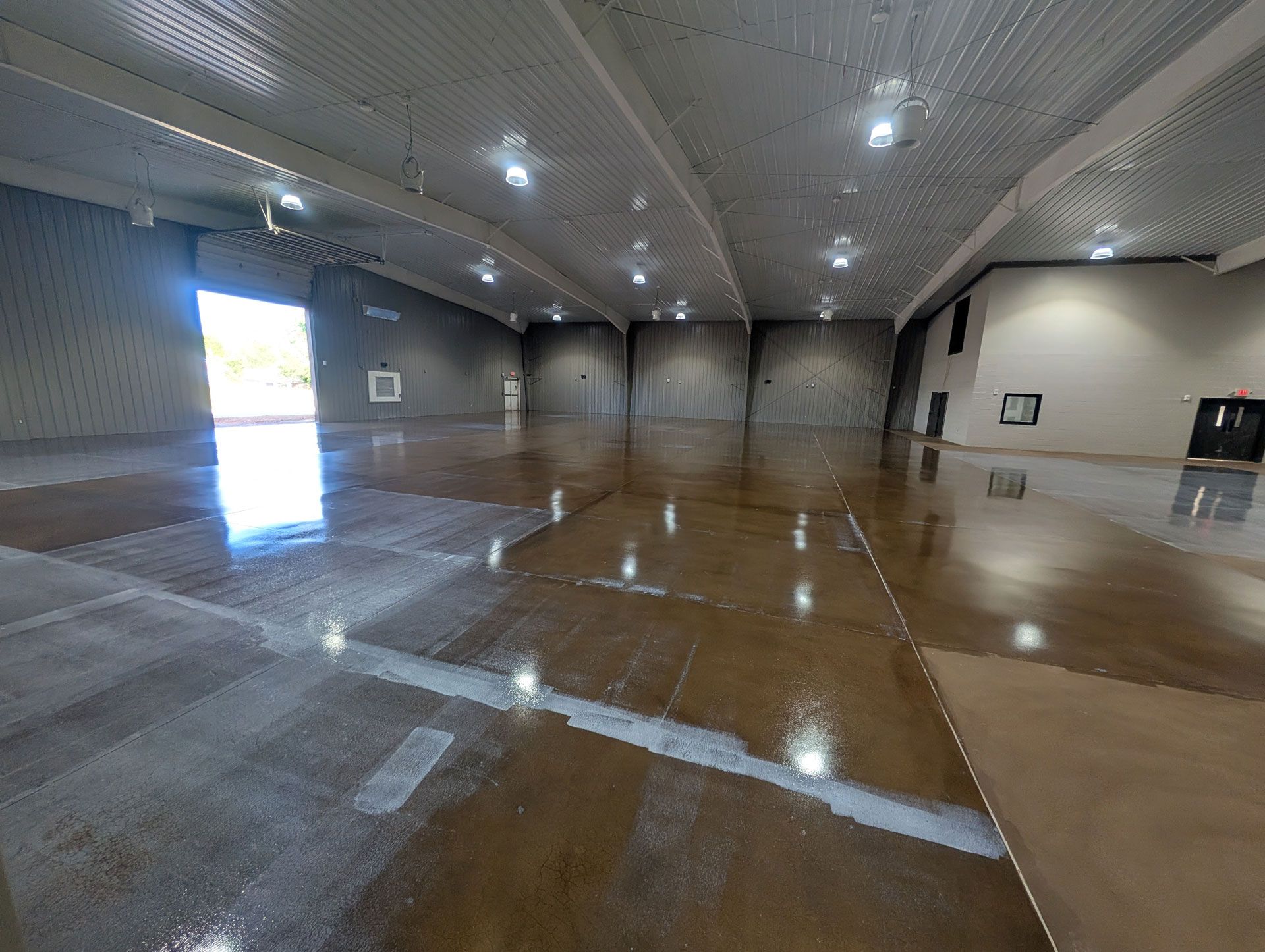 Zachary Daniel Concrete applied light blue epoxy flooring in a warehouse in Rock Hill, South Carolina.