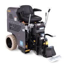 A machine that looks like a tractor is sitting on a white surface.