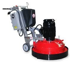 A red and black machine with wheels and a motor on a white background.
