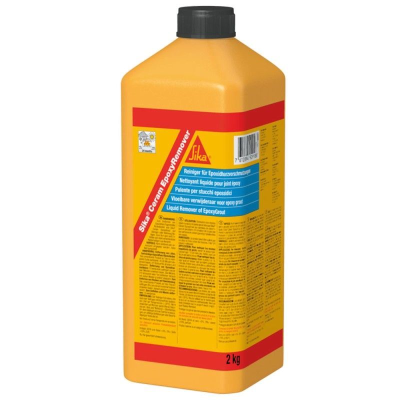 A yellow and red bottle of sika cement