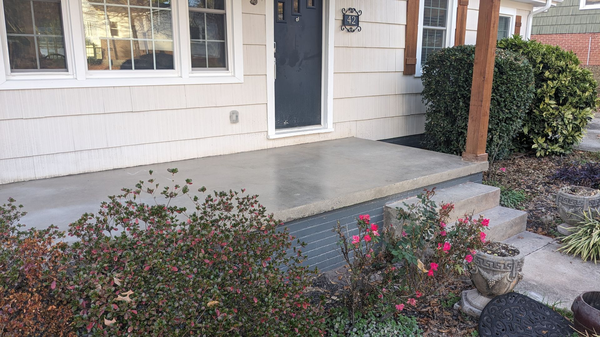 Concrete patio and landscaping design for homeowners