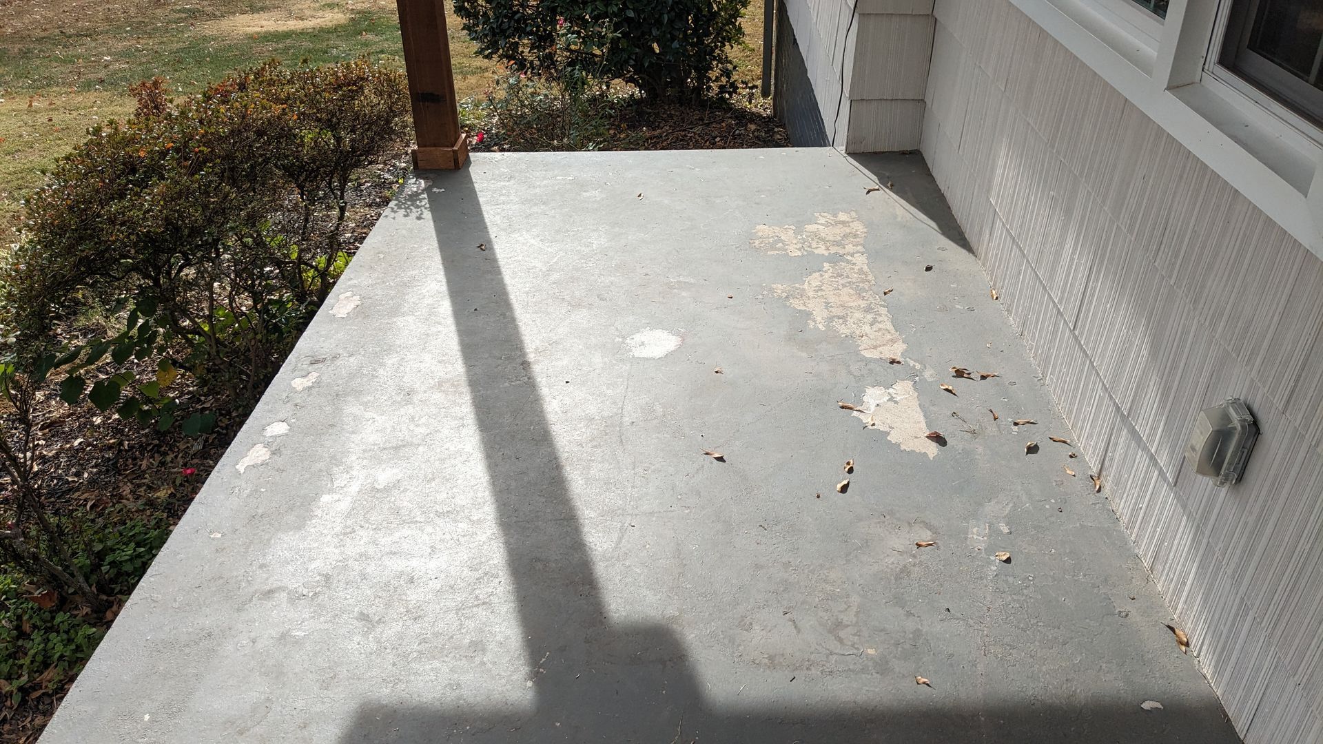 fading and cracked concrete patio