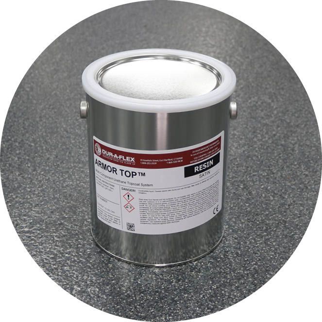 A can of resin is sitting on a gray surface.