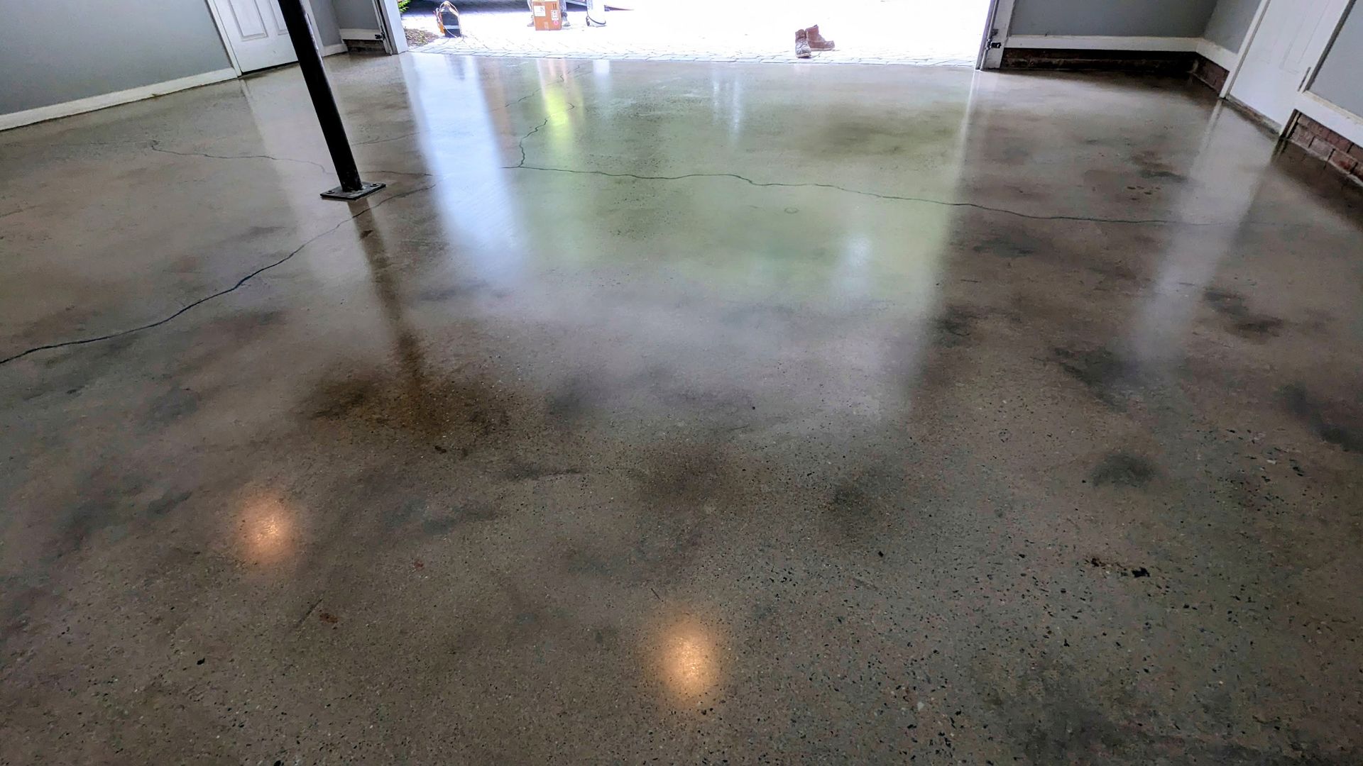 Zachary Daniel Concrete installed black metallic epoxy flooring for a garage in Concord, North Carolina.