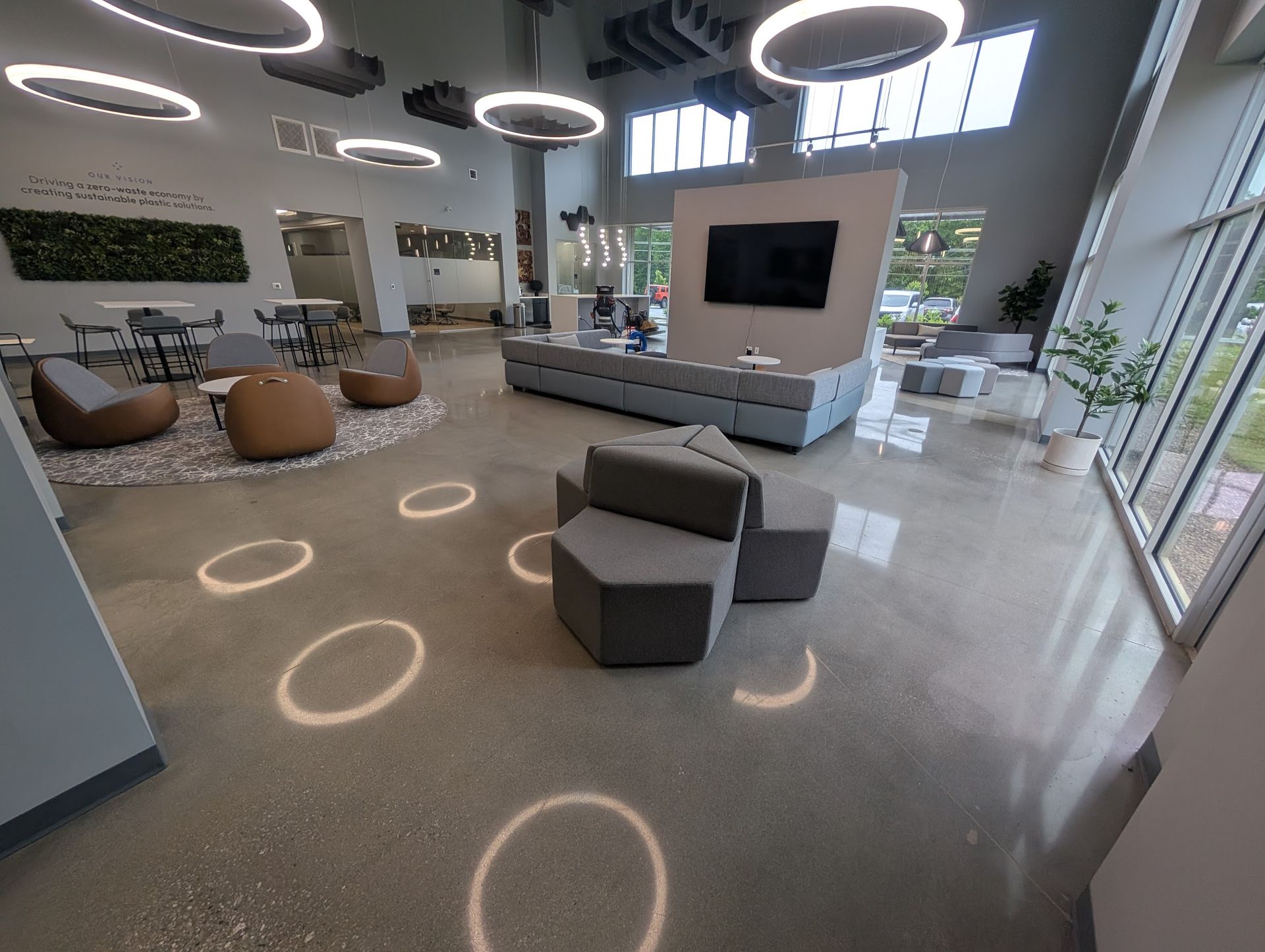A dirty floor with a lot of stains on it in a room.