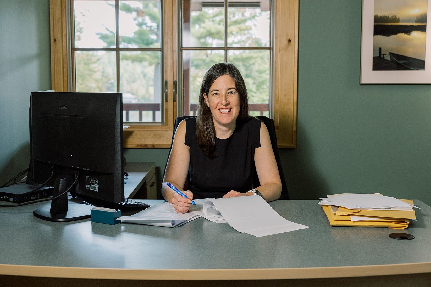 Attorney Molly Hann of Flink Maswick Law at her desk in Tupper Lake, NY