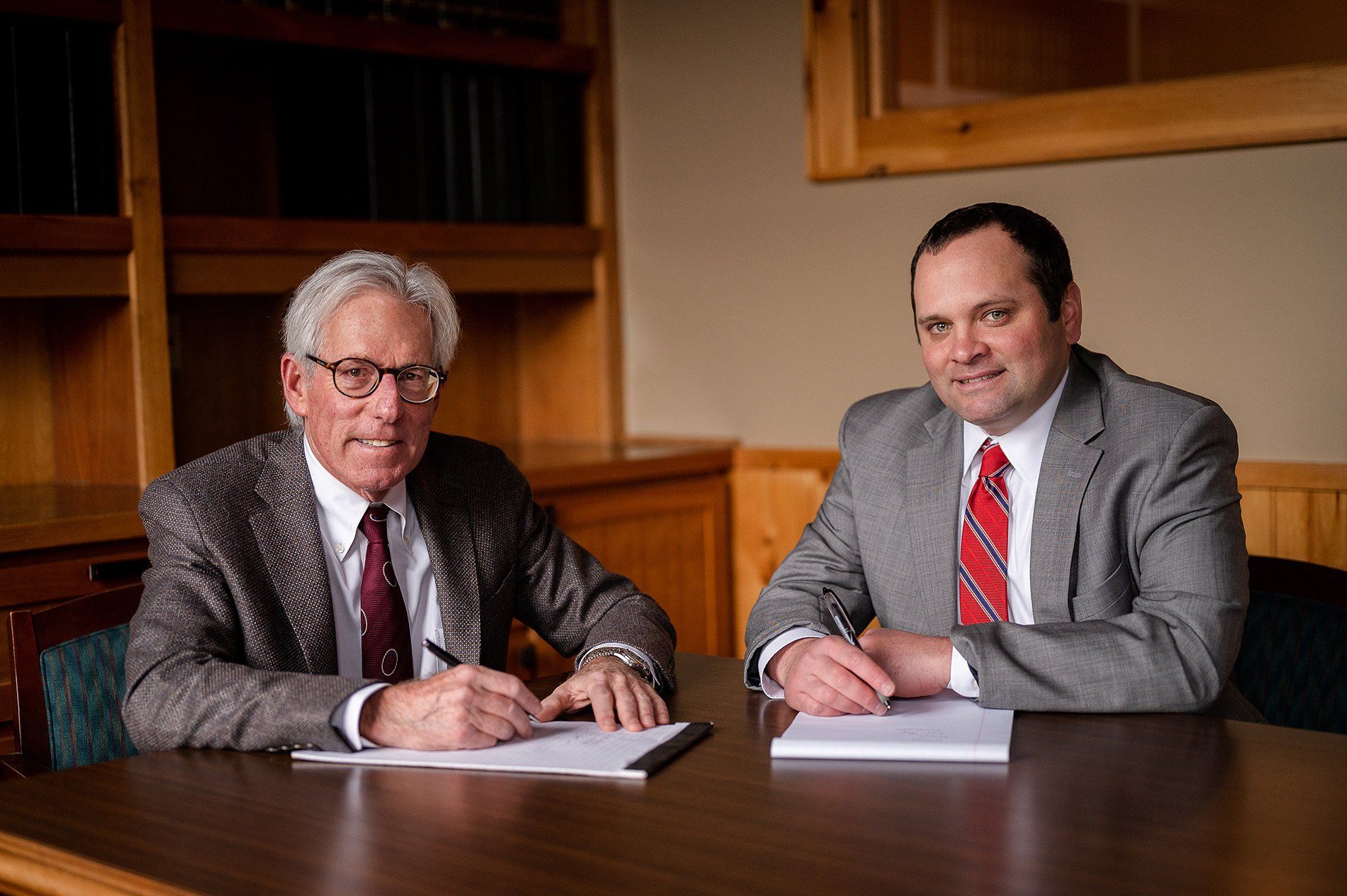 Attorneys Edward B Flink and James L Maswick at conference table
