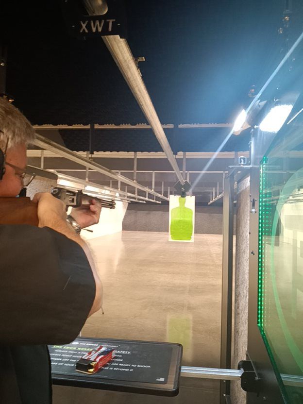Shooter practicing at an indoor lane
