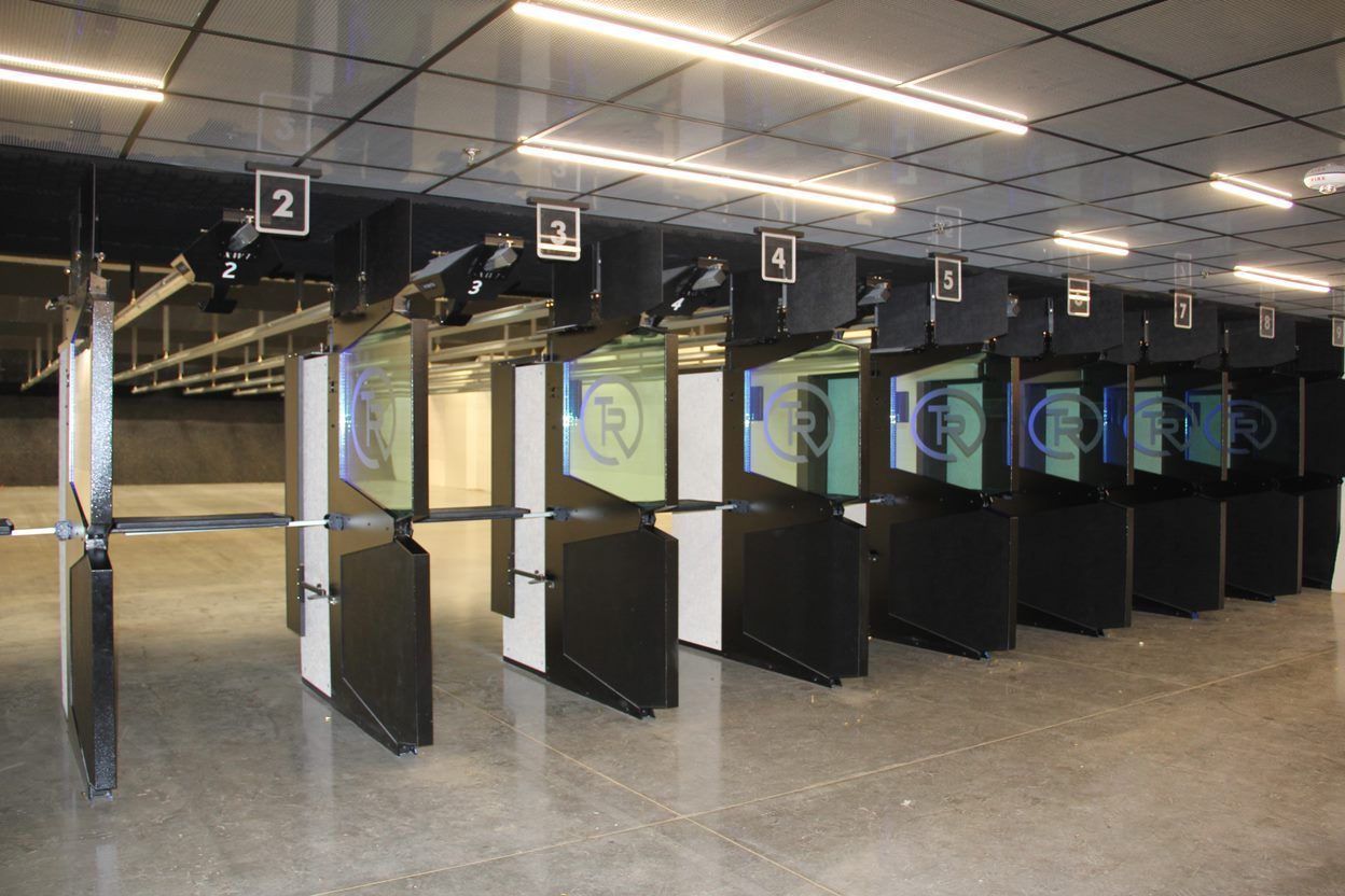 Indoor shooting lanes with green targets