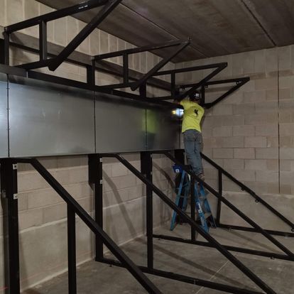 Worker on the steel framing during construction