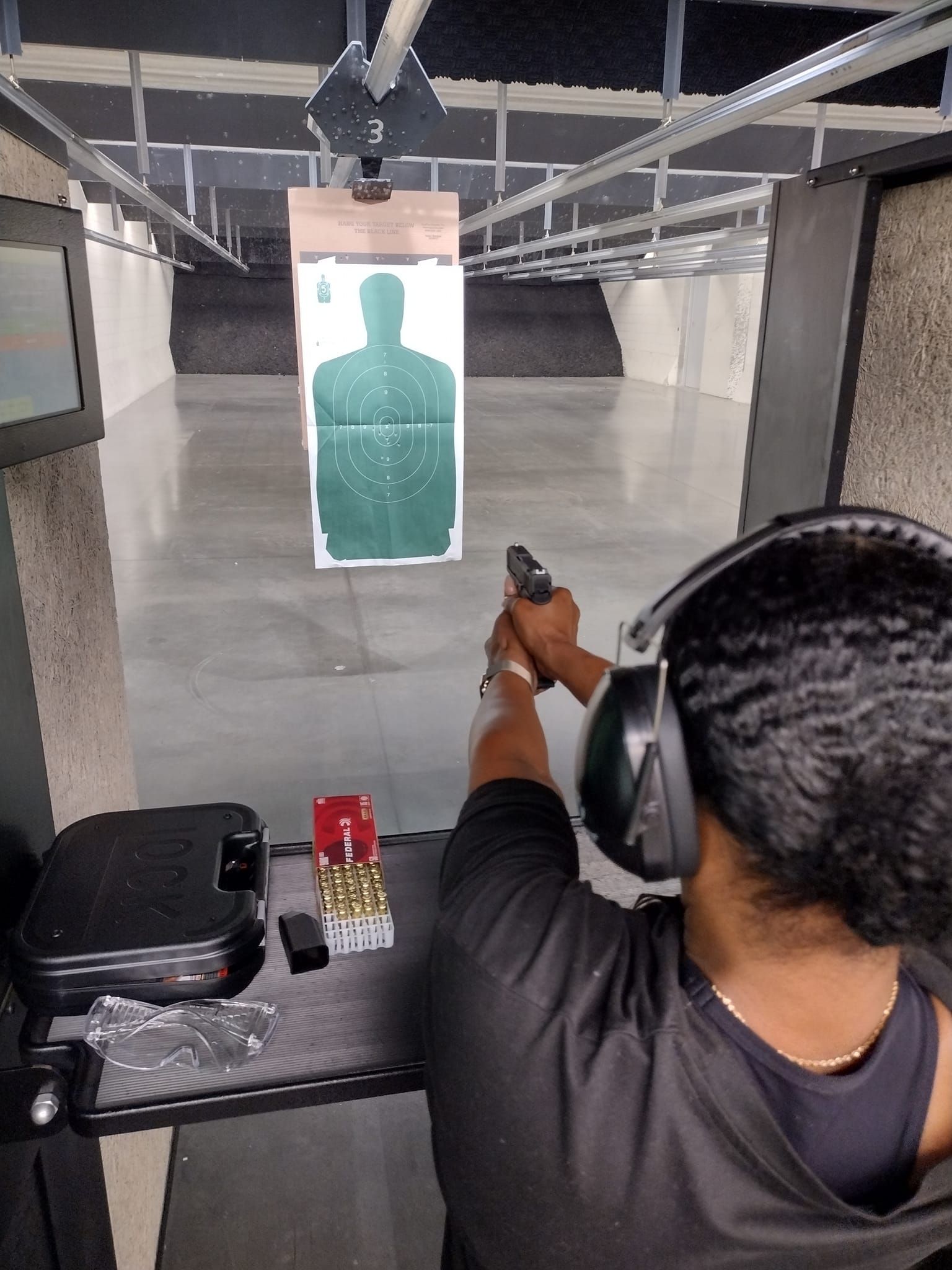Student shooting at a silhouette target