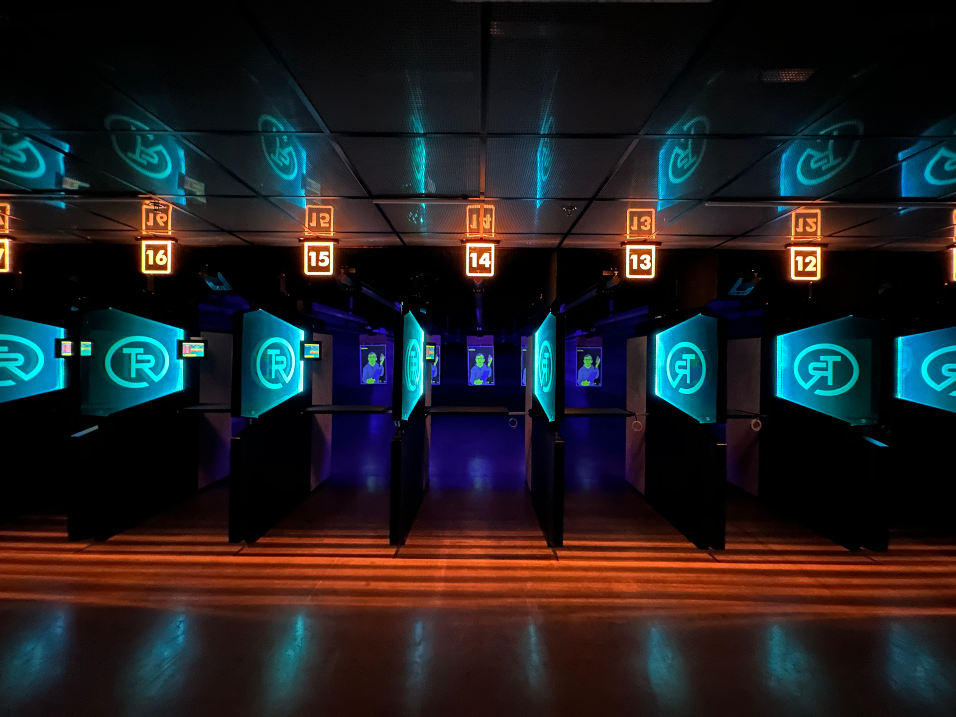 Wide view of the indoor shooting lanes with LED lighting
