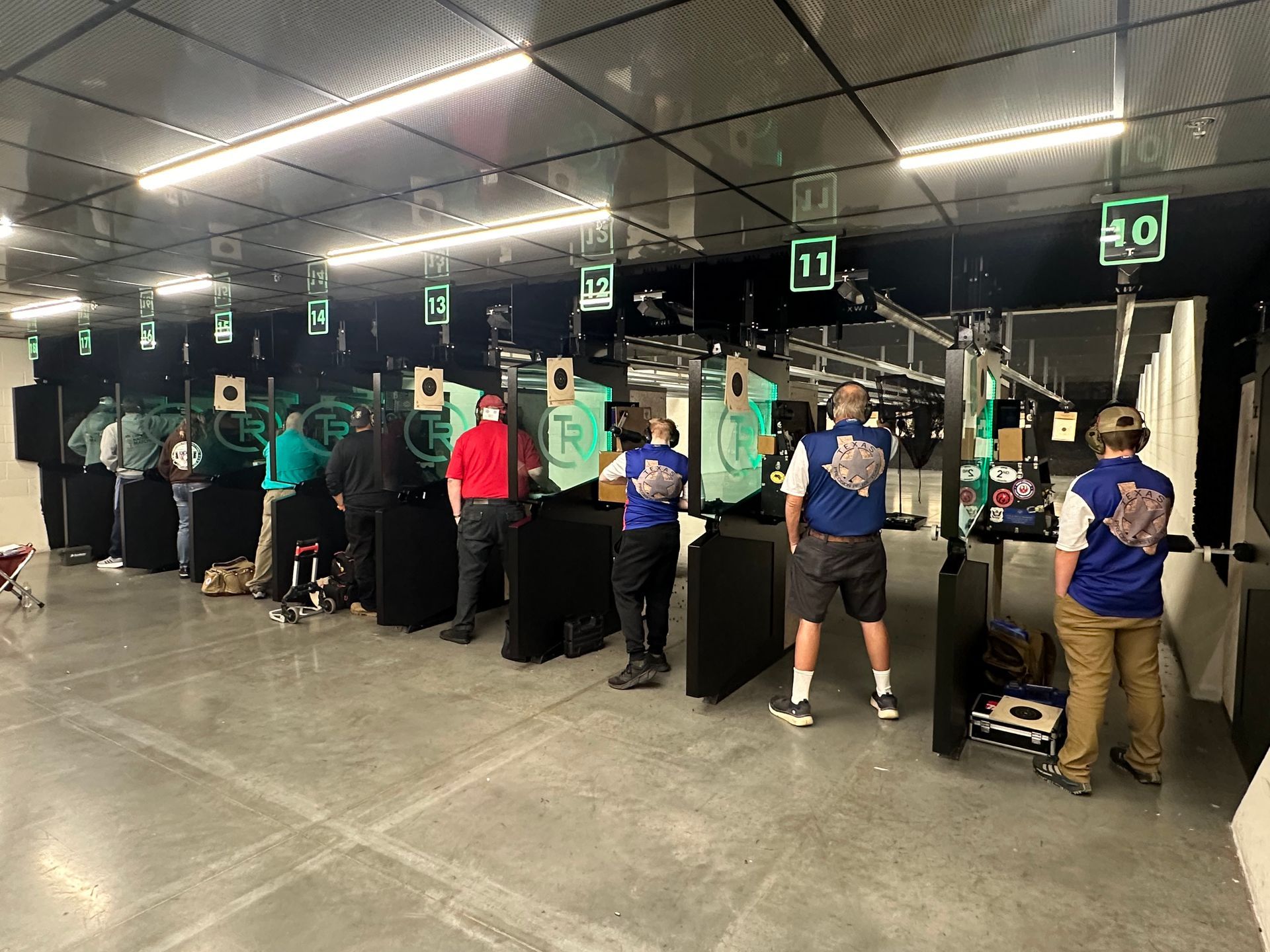 Row of shooters at the indoor lanes
