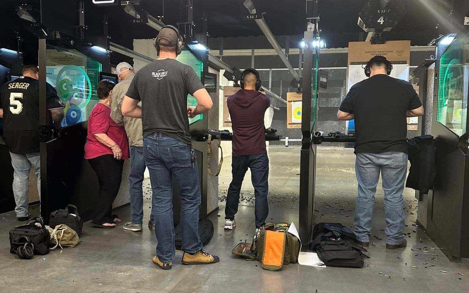 Row of shooters practicing at the indoor lanes