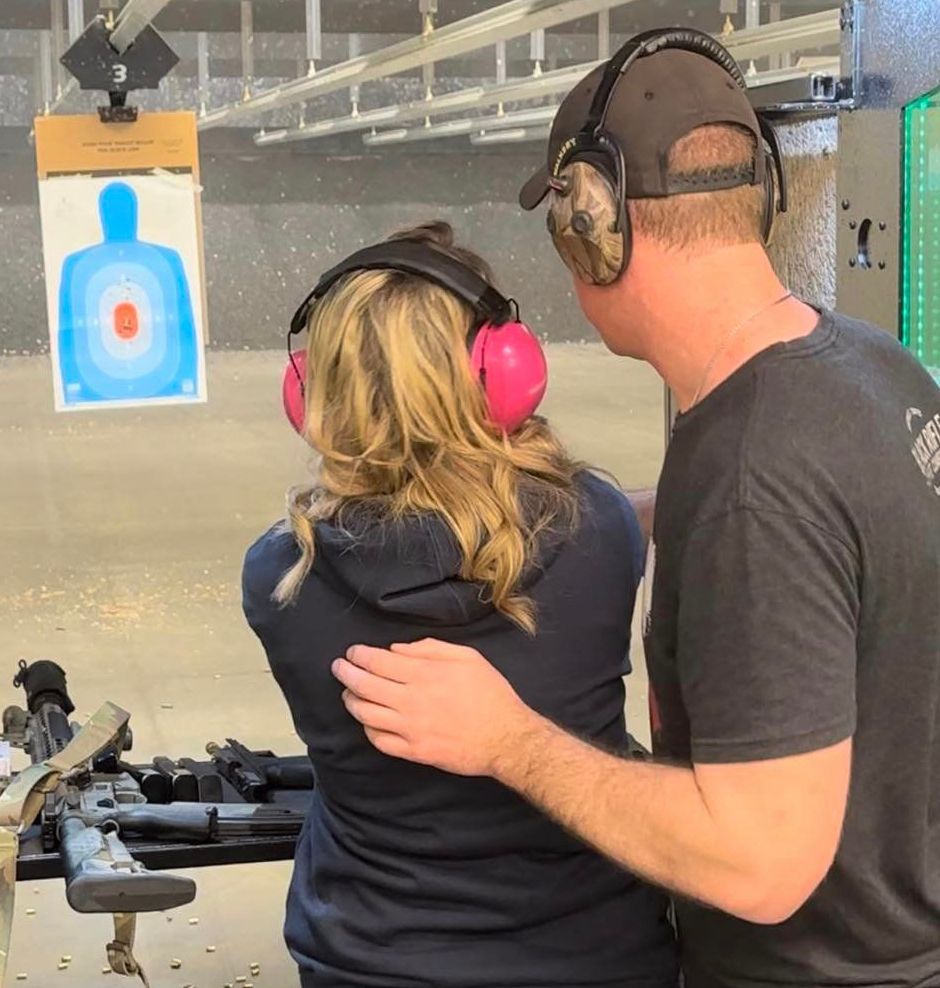 Couple wearing ear protection together at the range