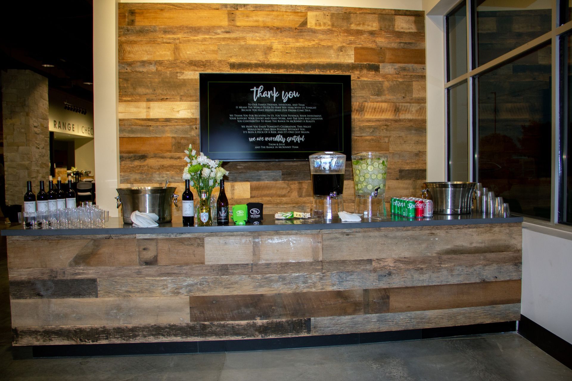 Bar and counter area with a wood accent wall