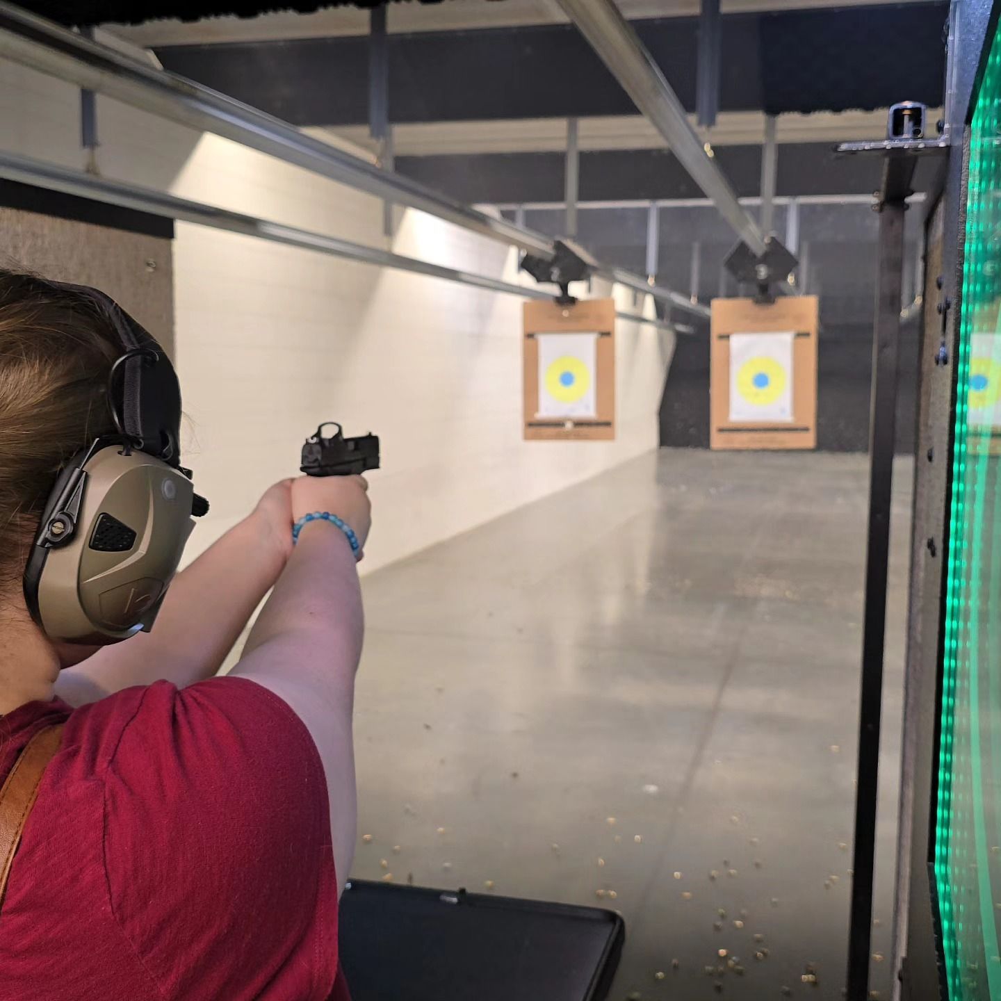 Woman aiming a pistol
