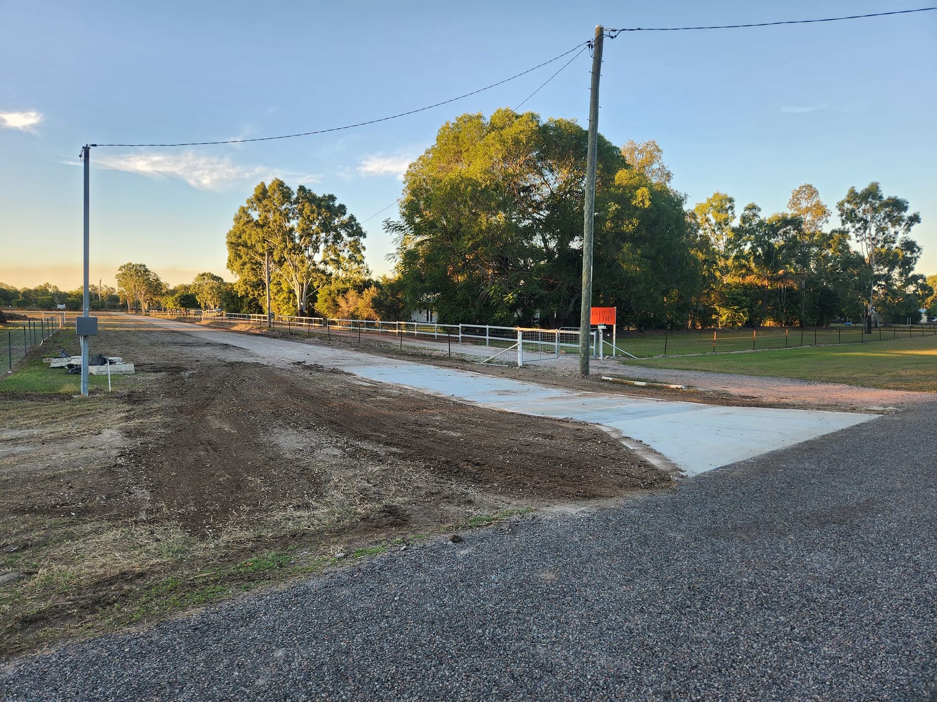 Gravel Road Intersecting a Concrete Path — AGM HIRE NQ in Kirwan, QLD