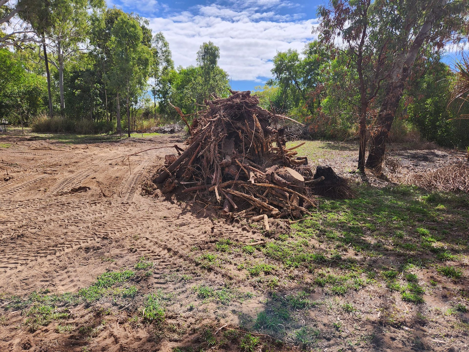 Pile of Dry Brush and Debris in a Cleared Field — AGM HIRE NQ in Kirwan, QLD