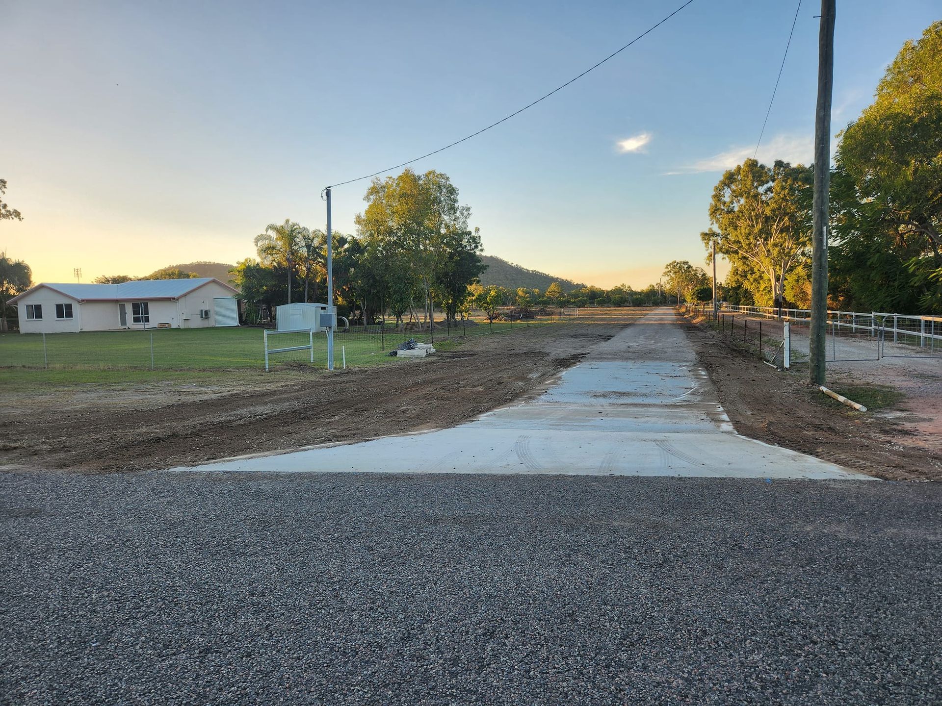 Gravel Road Transitioning to a Concrete Driveway — AGM HIRE NQ in Condon, QLD