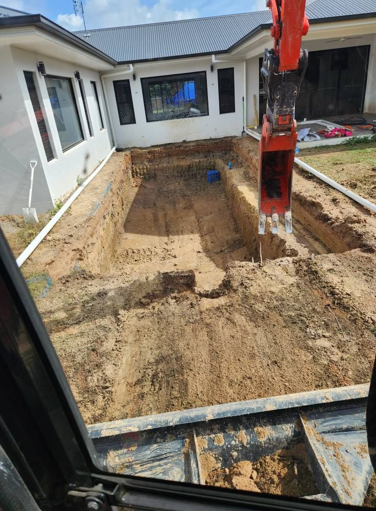 Excavator Digging a Rectangular Pool in a Backyard — AGM HIRE NQ in Condon, QLD