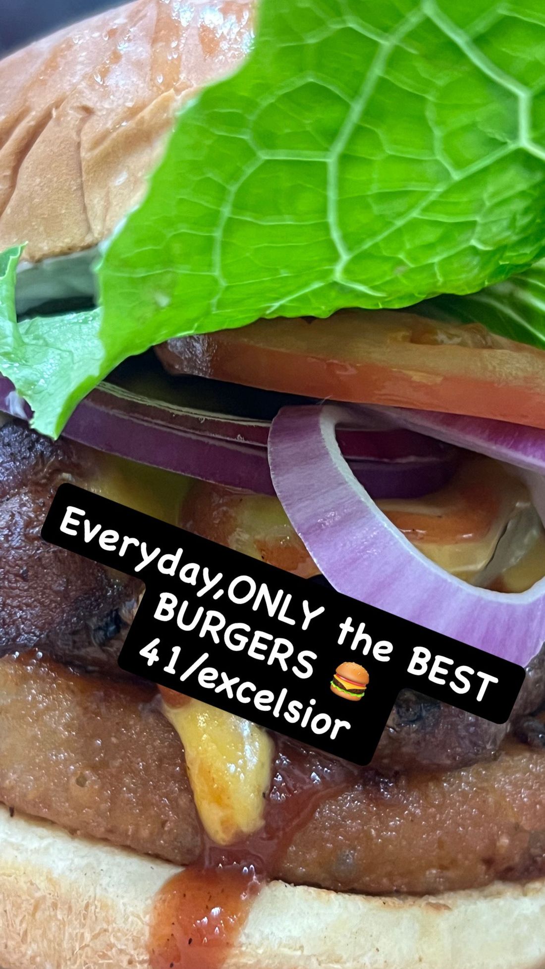 Close-up of a burger with lettuce and onion, overlaid with text: “Everyday, the BEST BURGERS 4/1/excelsior”