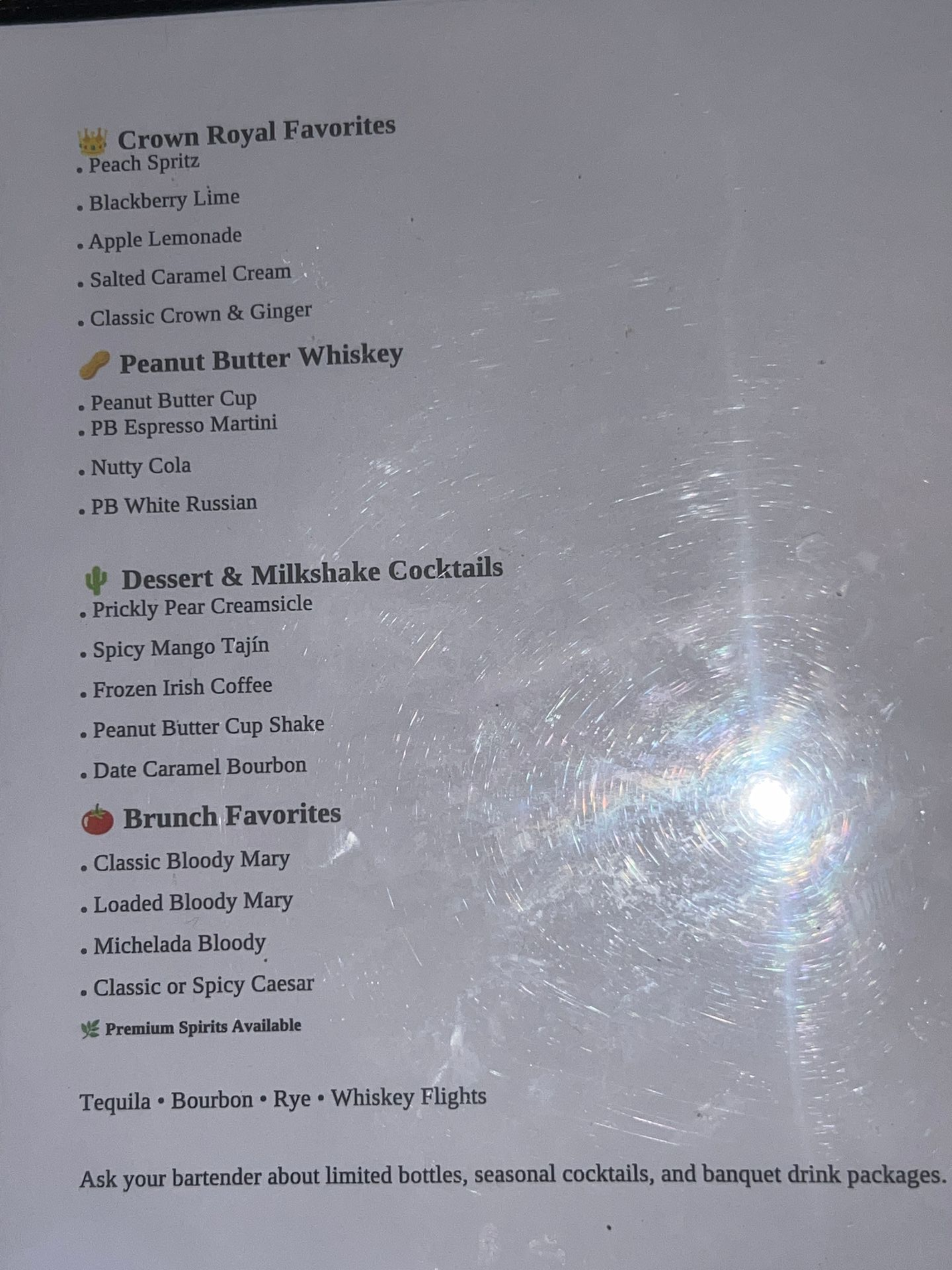 Blurry photo of a printed checklist page with bullet points and faint text, lit by glare.