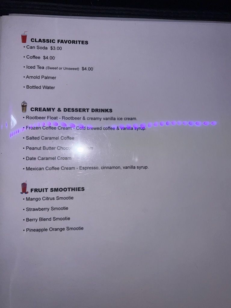 Blurred photo of a textbook page with sections on classroom tools, creativity, and fruit smoothies.