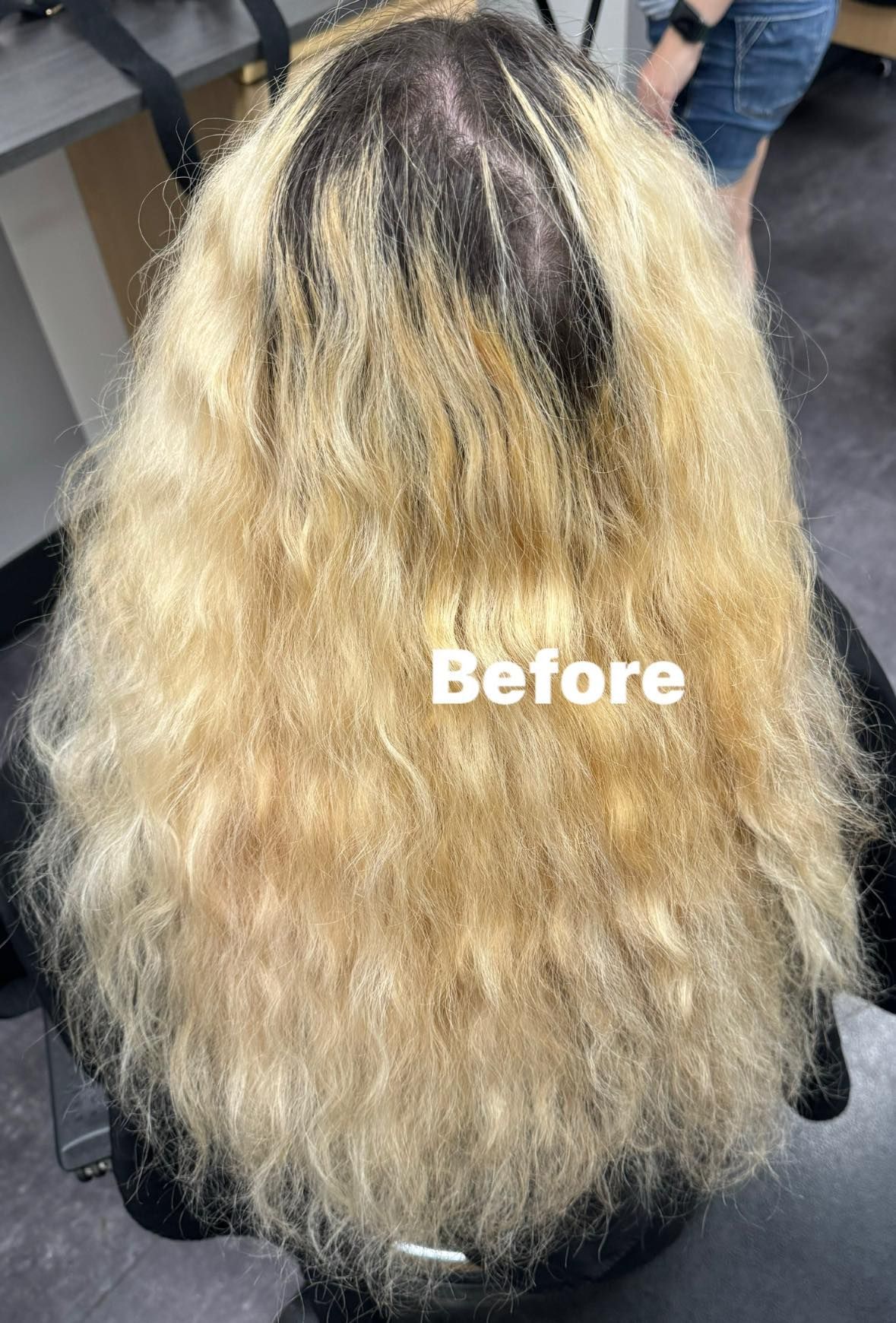 Back view of long, wavy blonde hair with dark roots, labeled “Before”