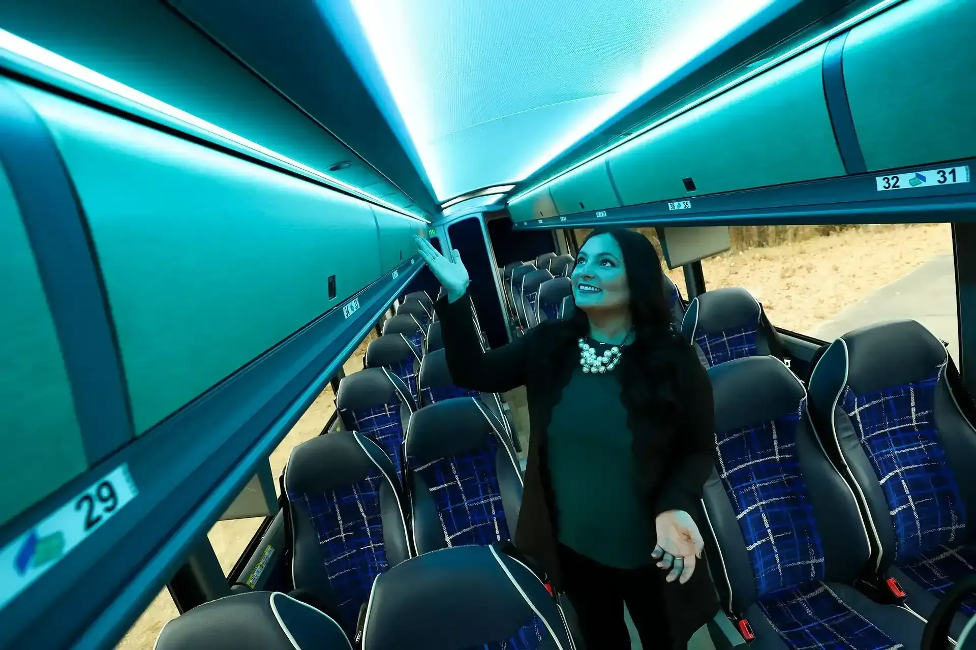 A Woman Is Showcasing the Interior and Features of a Deluxe Motor Coach in St. Cloud, MN
