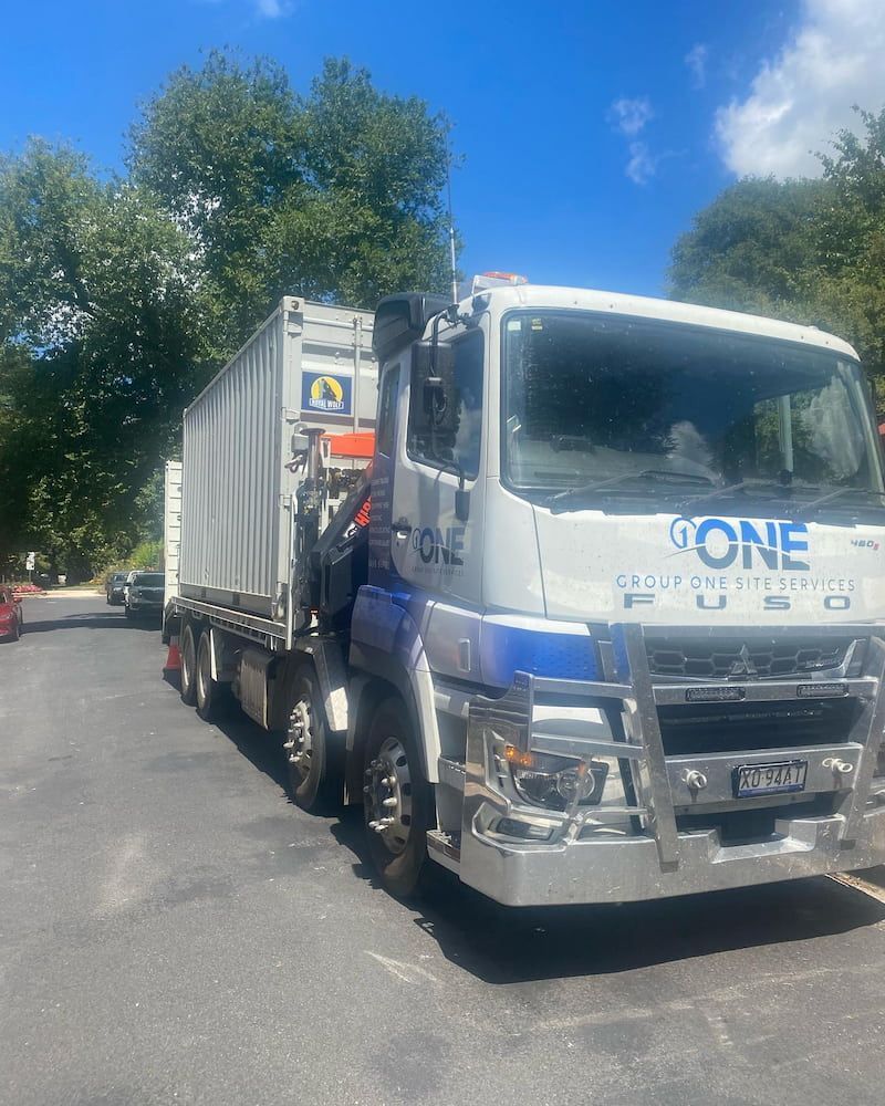 A White Truck With the Word Gone on the Front is Parked in a Parking Lot — One Group Industries Pty Ltd in Bathurst, NSW
