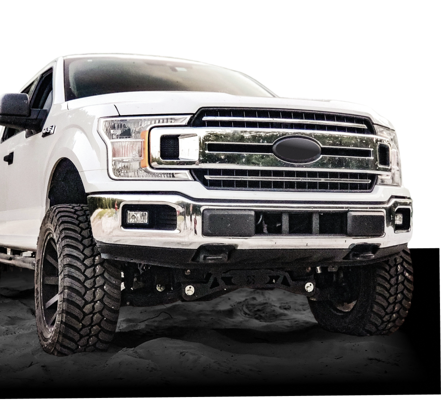 White lifted Ford pickup truck with oversized off-road tires, front view on a plain white background | Joe's Garage