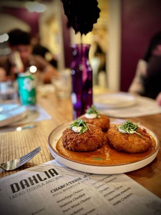 Jamon Croquettas with bravas sauce on the bar at dahlia tapas