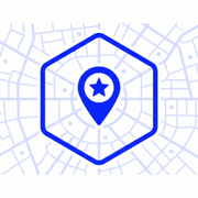 Blue map pin with star inside a hexagon over a faint city map background