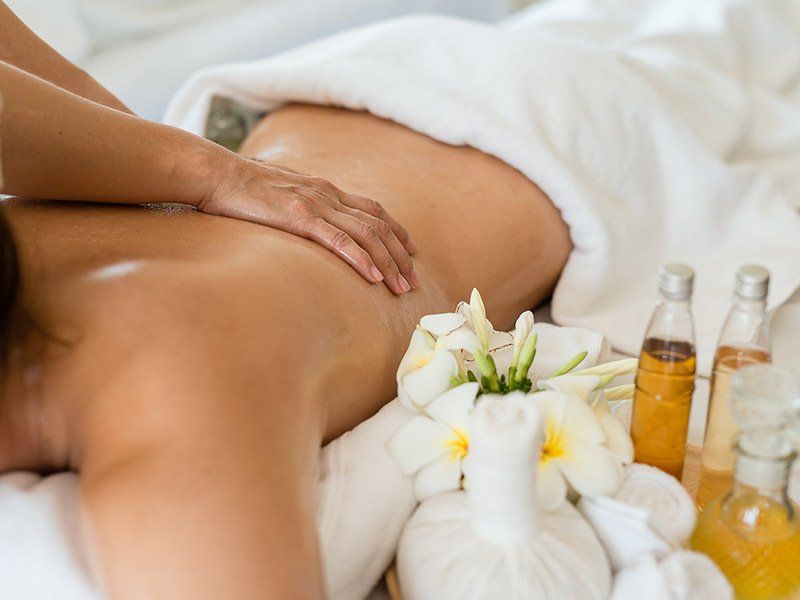 A woman is getting a massage at a spa.
