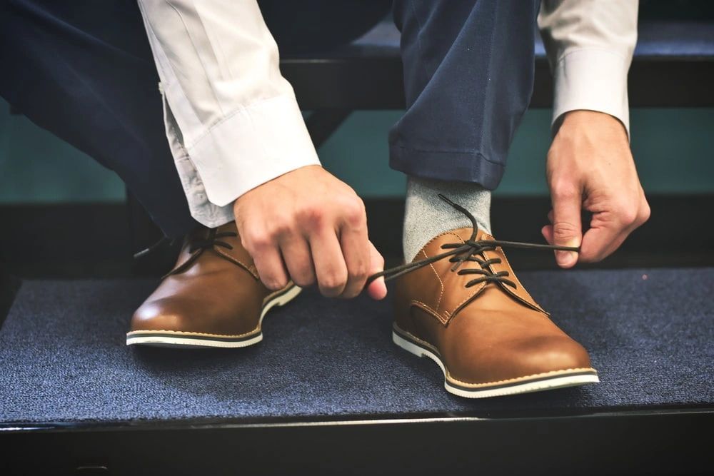 Man Ties Shoe - Prescott, AZ - Natural Back Pain Relief LLC