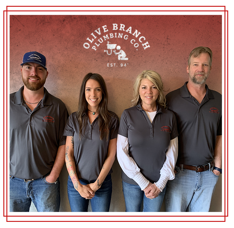 Olive Branch Plumbing Co. team: four people in gray shirts, logo backdrop.