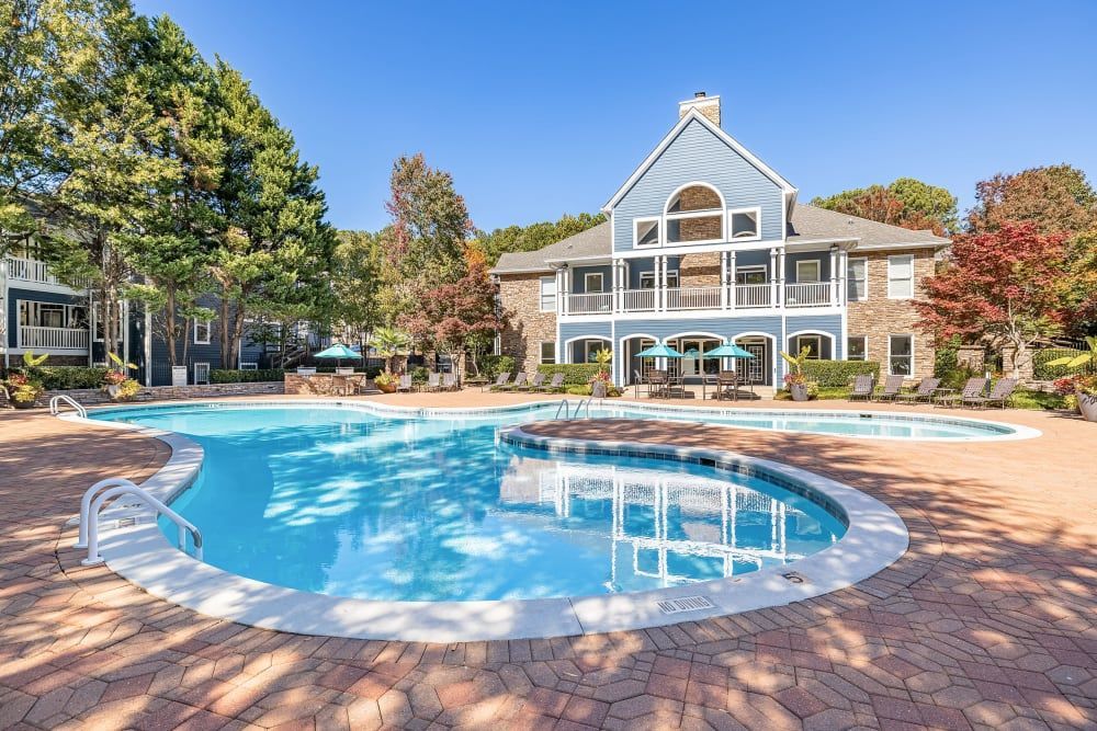 a large swimming pool in front of a building at Marquis on Edwards Mill in Raleigh, NC.