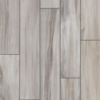 Gray wood plank flooring with varied rectangular boards and natural grain patterns