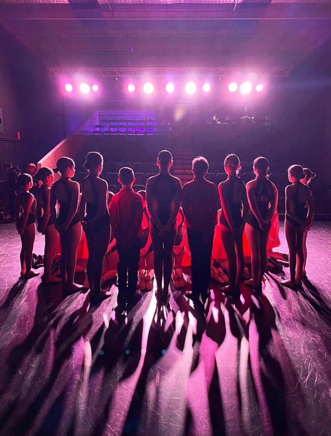 Students ready for their performance on stage