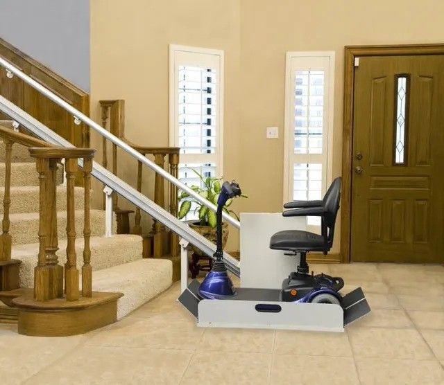 A stair lift with a scooter attached to it