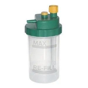 A clear plastic bottle with a green lid and a yellow hose attached to it.