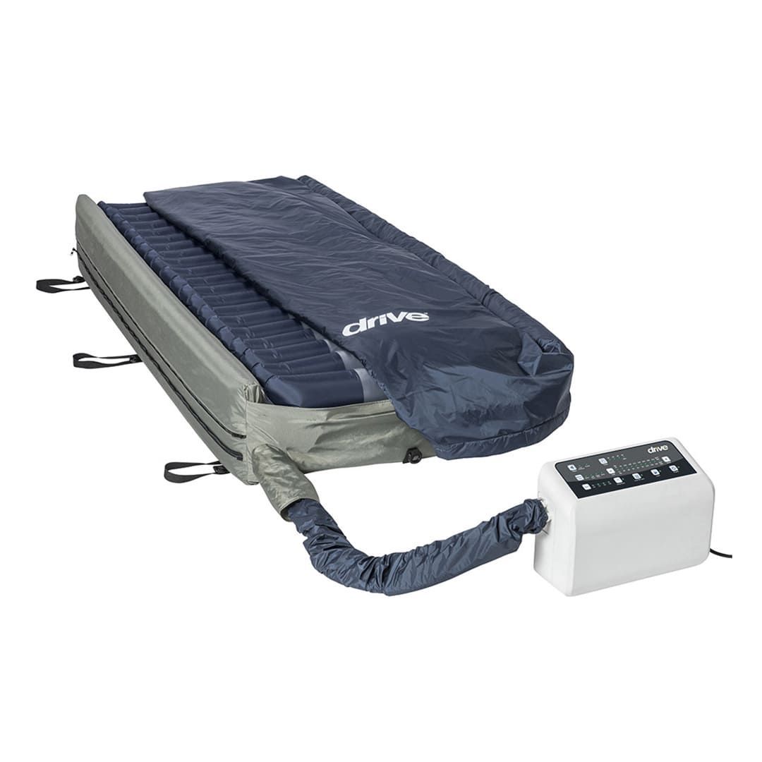 A mattress with a hose attached to it and a remote control.