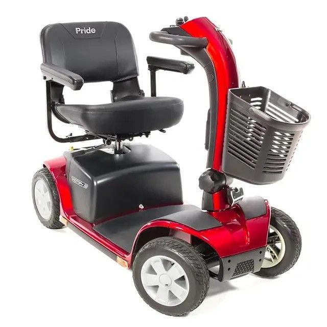 A red pride mobility scooter with a basket on the front