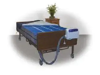 A hospital bed with a mattress and a machine attached to it.