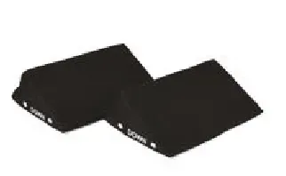 A black object is sitting on top of a white surface.