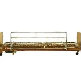 A wooden bed with a metal railing attached to it.