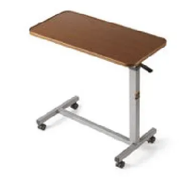A wooden over bed table with wheels on a white background.