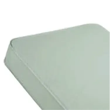A close up of a white mattress on a white background.