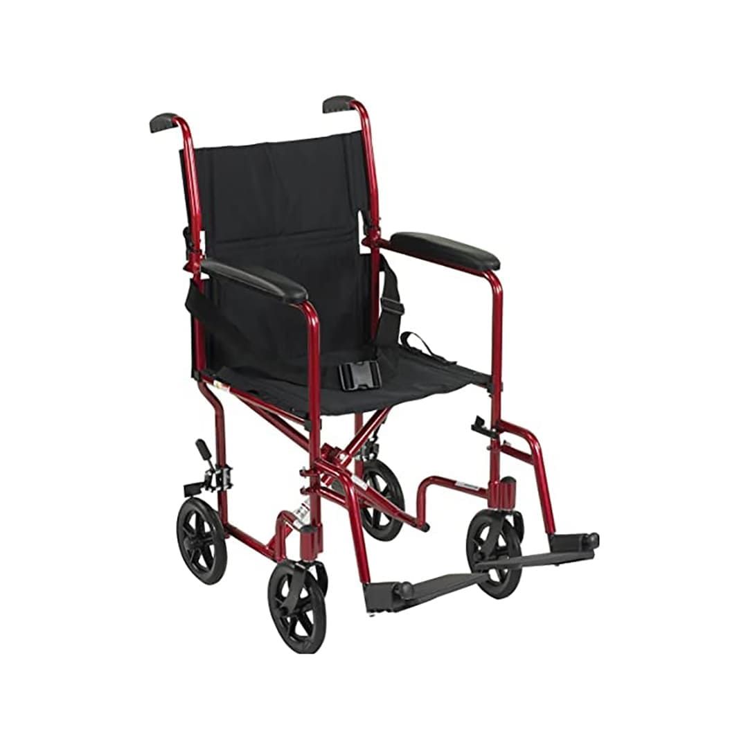 A red wheelchair with a black seat and black wheels on a white background.
